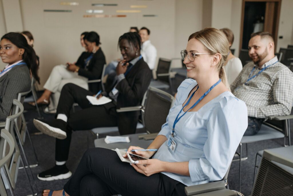 Services Participants attentively engage in a seminar, showcasing diversity and collaboration.